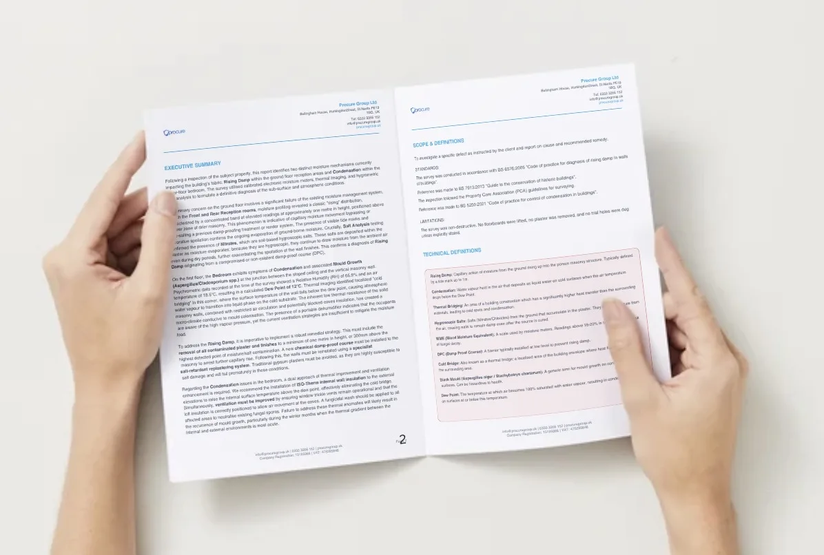 A homeowner reading a Procure Group damp survey report with findings and technical definitions